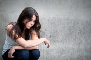 Image of woman looking pensive